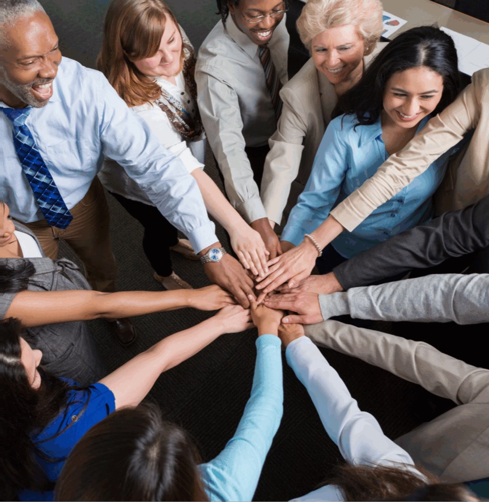 RCA Global team with hands together — join our growing company